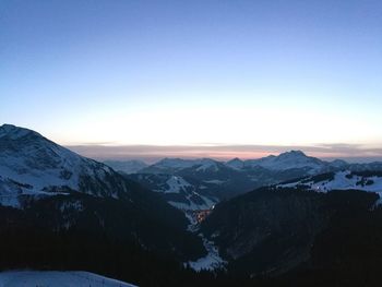 Scenic view of mountains against clear blue sky