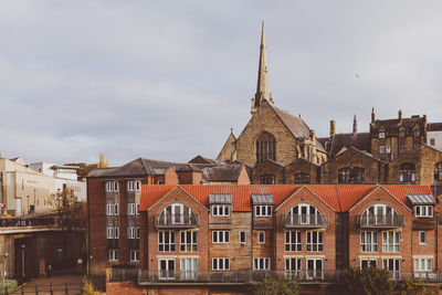 Buildings in city against sky, durham, united kingdom 