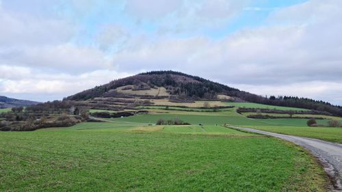 Scenic view of farm against sky