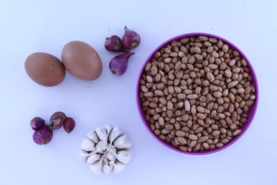 High angle view of candies against white background