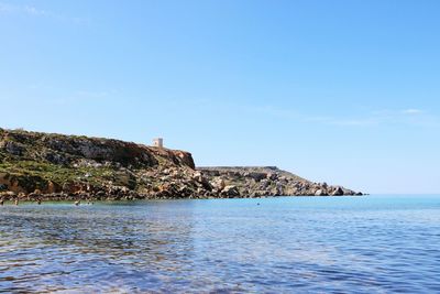 Scenic view of sea against blue sky