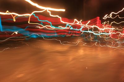 Illuminated fountain at night