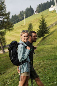 Portrait of young couple on field