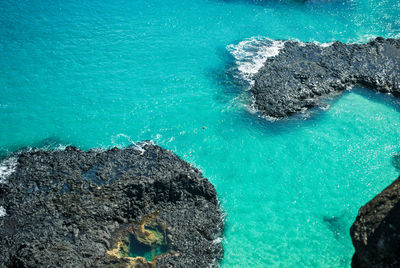 High angle view of rock formation in sea