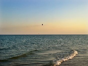 Scenic view of sea against clear sky during sunset