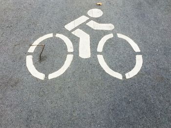 High angle view of bicycle lane sign on street