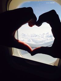 Low angle view of cropped object against sky