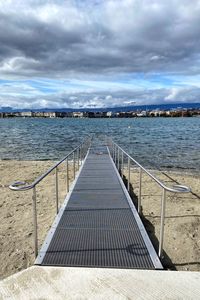 Pier over sea against sky