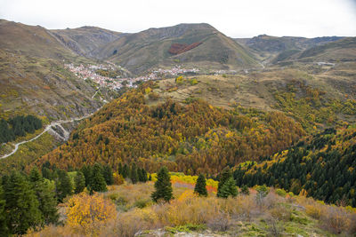 Scenic view of landscape and mountains against sky