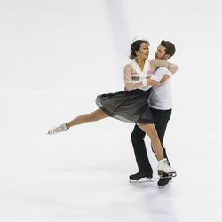 Young couple against white background