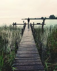 Scenic view of pier on sea against sky