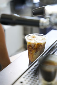 Close-up of iced latte on the counter of a coffee shop in los angeles, ca