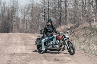 Man riding motorcycle on road