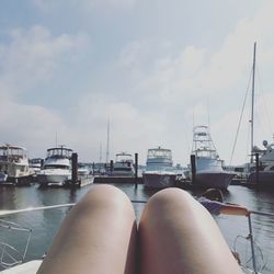 Low section of man relaxing on sailboat