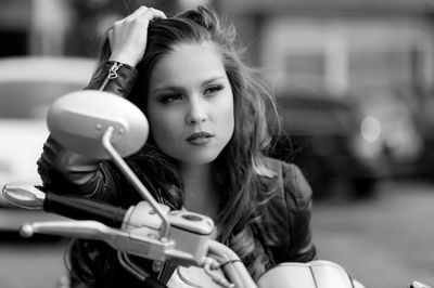 Close-up of young woman holding camera