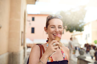 Portrait of mature woman eating ice cream