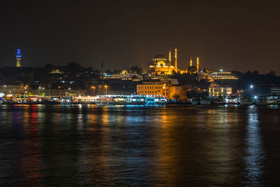 Illuminated buildings in city at night