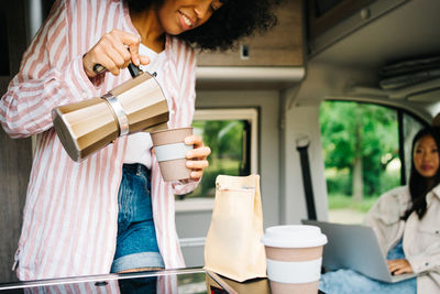 Woman holding coffee cup