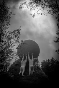 Low angle view of statue against sky