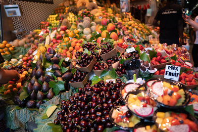 Exotic fruits and berries are sold in the market. gastronomy and rising prices of products.