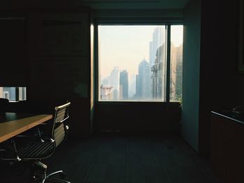 Empty chairs and tables in building