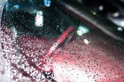 Full frame shot of raindrops on windshield