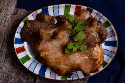 High angle view of meat in plate on table