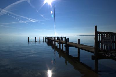 Pier over sea against sky