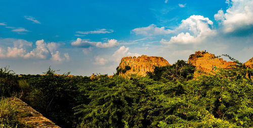 Low angle view of rocks against sky