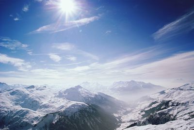 Scenic view of snowcapped mountains against sky