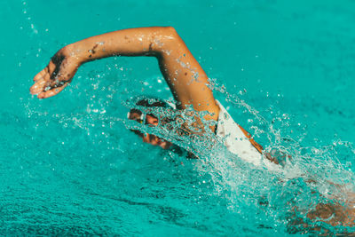 Man swimming in pool