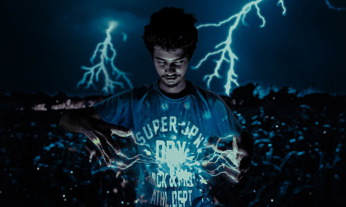 Portrait of young man at night