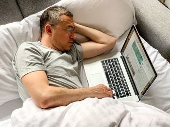 Young woman using laptop at home