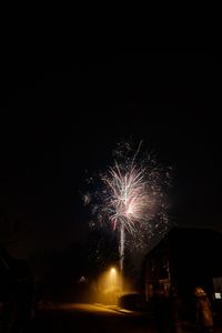 Firework display in sky at night