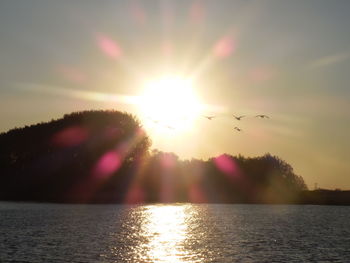 Scenic view of sunset over river