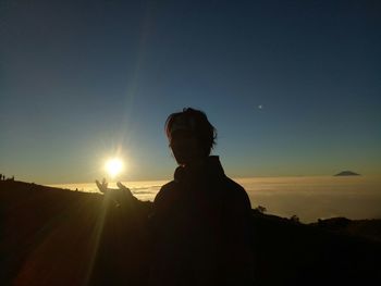 Portrait of silhouette man standing against sky during sunset