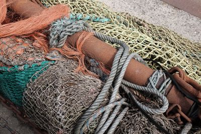 High angle view of fishing nets and buoys on pier