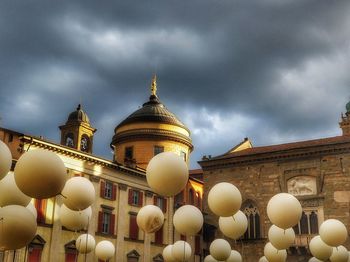 Low angle view of traditional building against cloudy sky