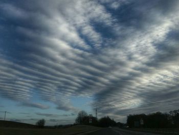 Low angle view of dramatic sky over landscape