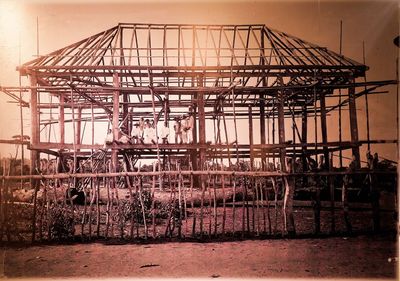 Metallic structure at construction site against sky