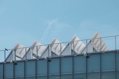 Low angle view of factory against sky