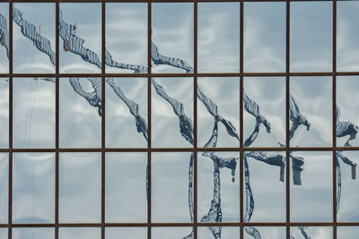 Distorted reflection of crane.