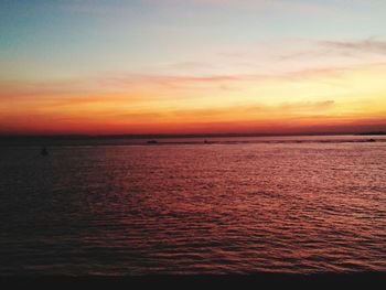 Scenic view of sea against sky at sunset