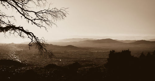 Scenic view of silhouette mountains against sky