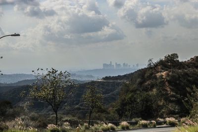 Scenic view of landscape against cloudy sky