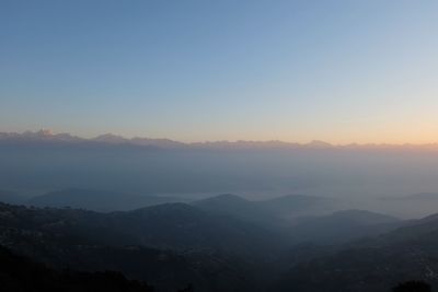 Scenic view of mountains against sky during sunset