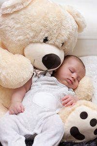 Cute baby sleeping in toy