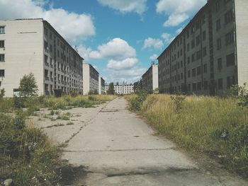 Narrow pathway along built structures