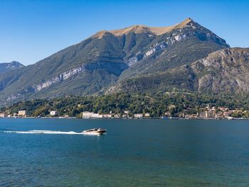 Sailboat in sea against clear sky