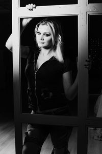 Portrait of woman standing at home